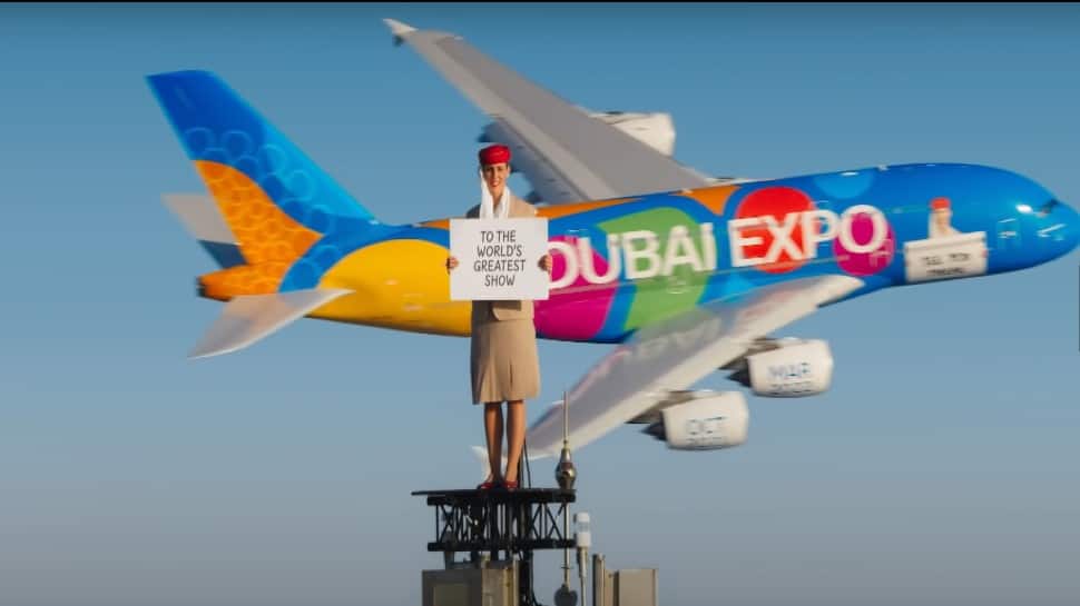 A stuntwoman stood on-top of the Burj Khalifa once again in the video sponsored by Emirates, but this time she has the company of an Airbus A380 