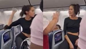 Delta Airline passenger throws a bottle at another passenger | EXCLUSIVE