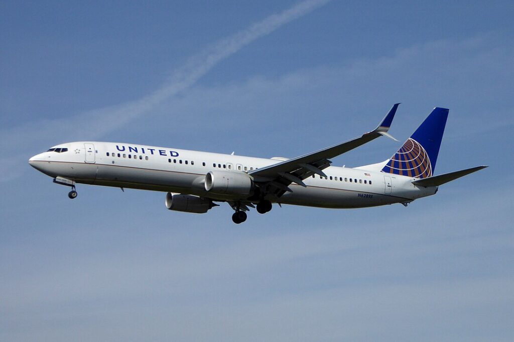 During this stationary phase, an American Airlines (AA) luggage cart hit the front right section of the United 737 aircraft.