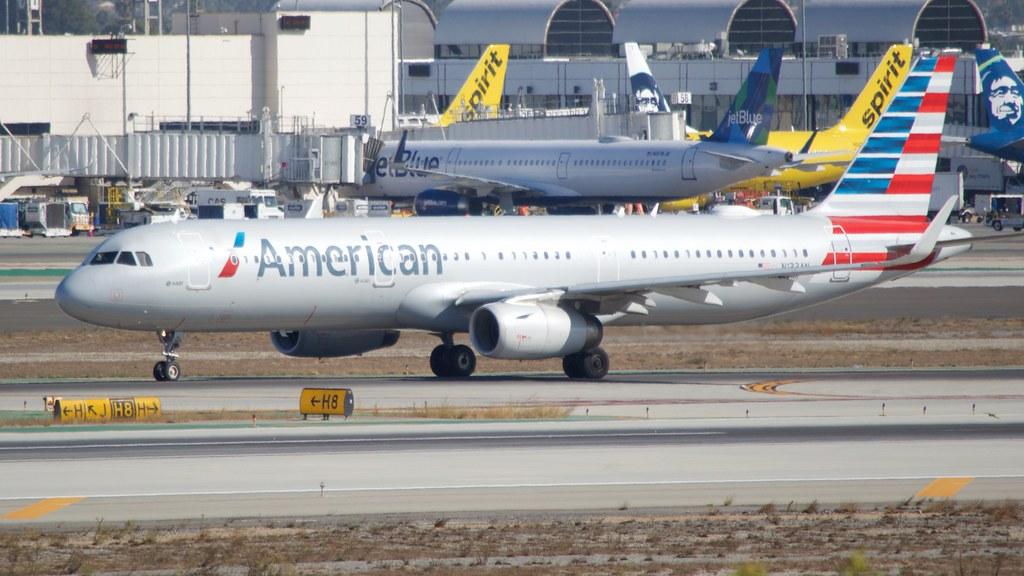 the alert and sharp Air Traffic Controller (ATC) at Boston Logan Airport (BOS) averted a possible mishap between American Airlines (AA) and Spirit Airlines (NK).