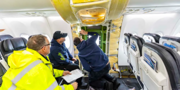 Alaska Airlines maintenance technicians inspect a Boeing 737-MAX 9 plug door prior to the aircraft returning to service. Photographed Janu