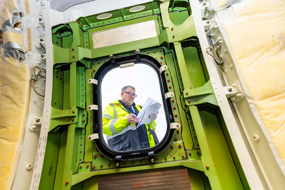 Alaska Airlines maintenance technicians inspect a Boeing 737-MAX 9 plug door prior to the aircraft returning to service. Photographed Janu