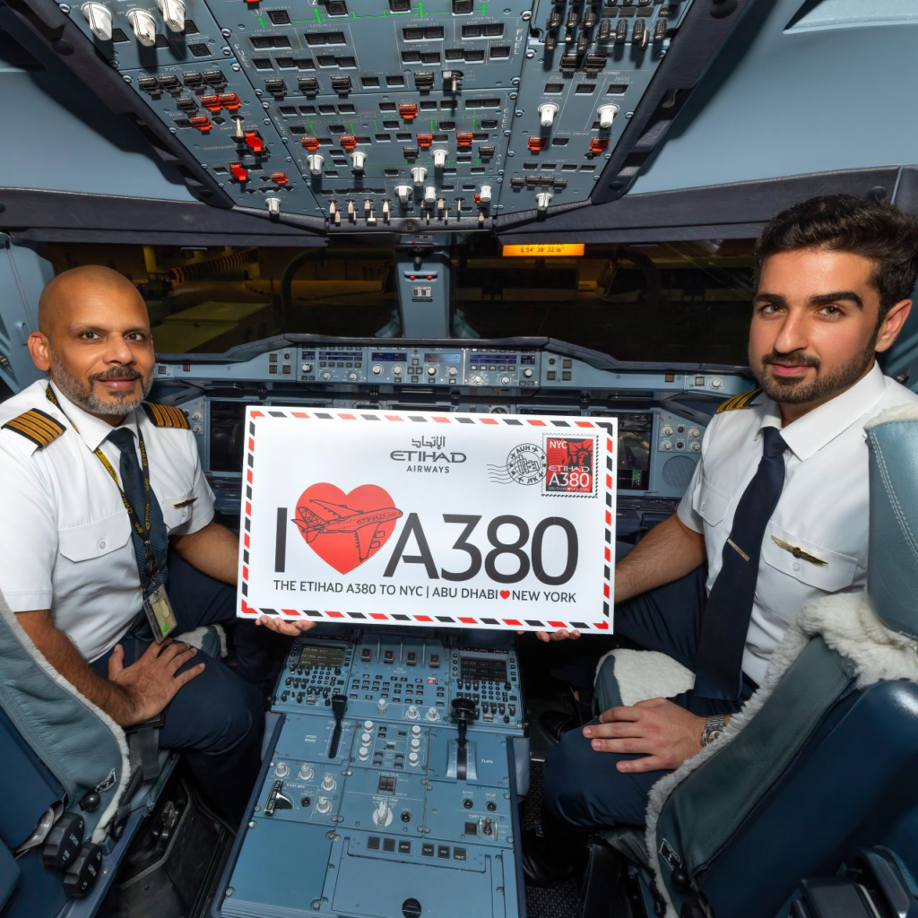 Etihad pilots waved the US and UAE flags from the cockpit after the super-jumbo arrived on its stand in New York.