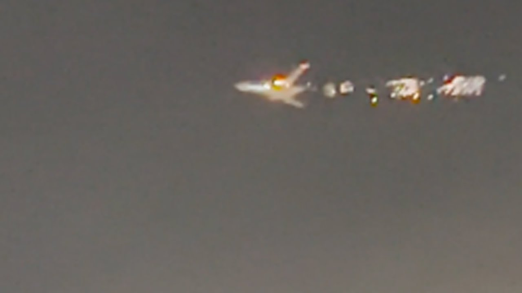 A Boeing 747 had to turn back after flames were seen emanating from its engine during takeoff.