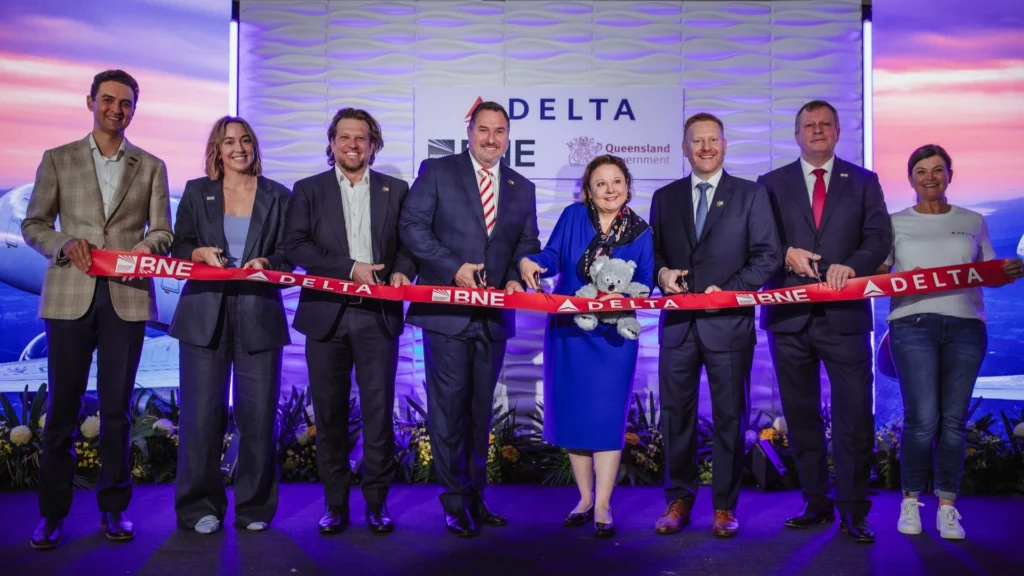 Brisbane Airport and Delta Air Lines Executive Celebrating First LAX - BNE Flight