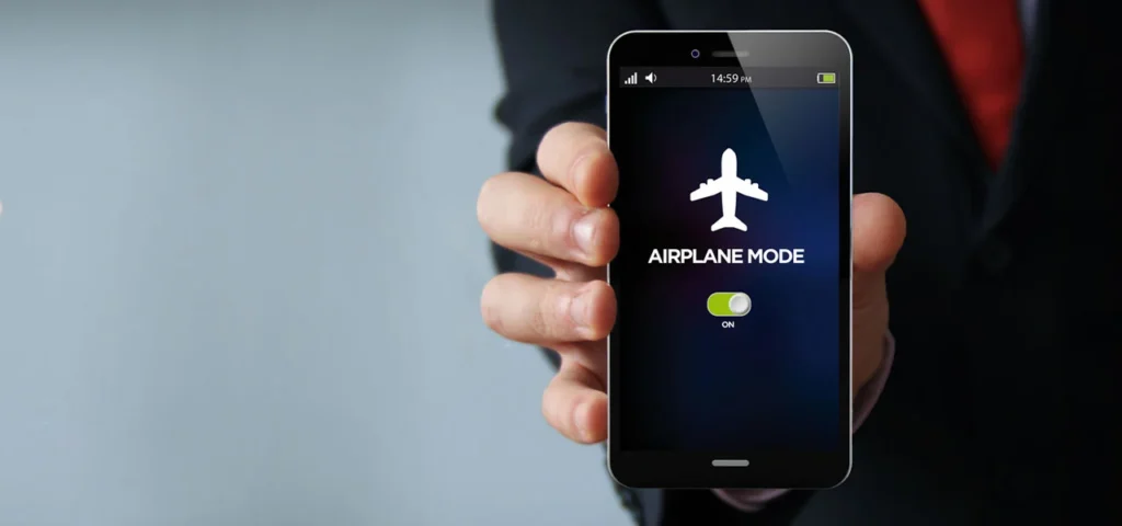 Airline passengers regularly hear instructions to switch phones to airplane mode, yet many question the necessity behind this long-standing aviation rule.
