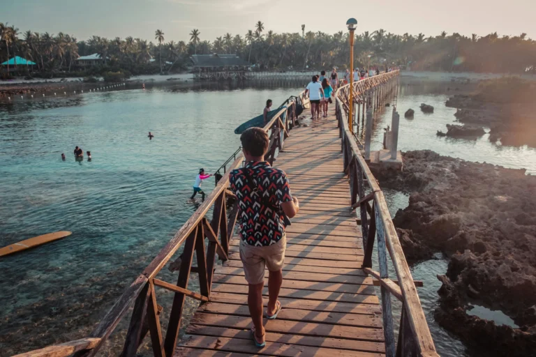 Siargao coastal town wooden bridge connecting to Cloud 9 wave's