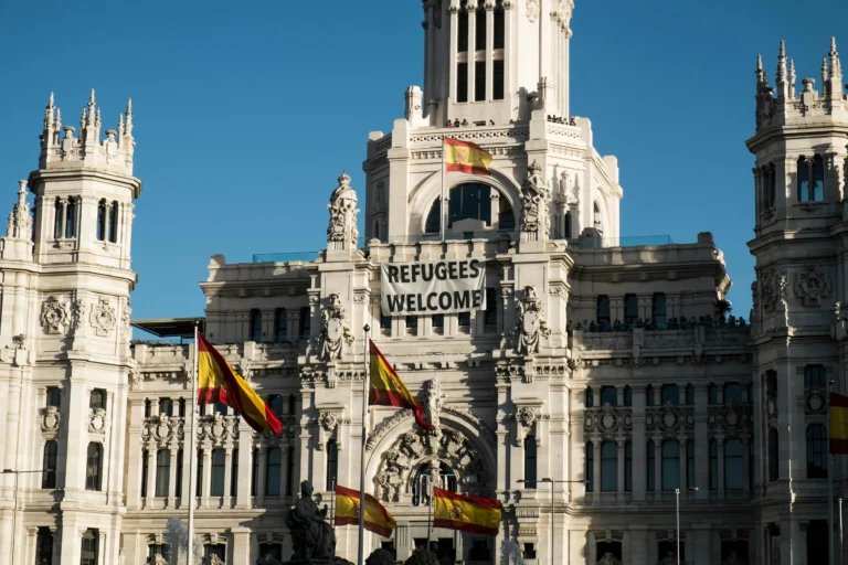 Top 10 Countries in the World for Healthcare for Expats in 2026 Cibeles Palace Facade with National Flags of Spain in Madrid
