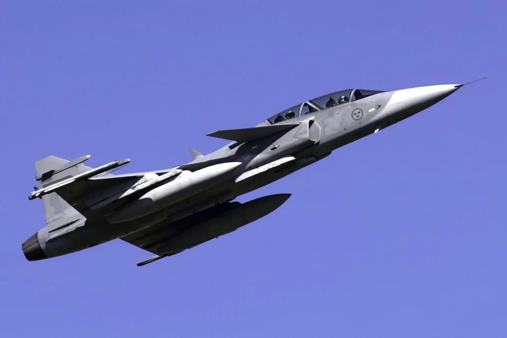 Saab Gripen fighter jet on the runway during a military aviation exercise.