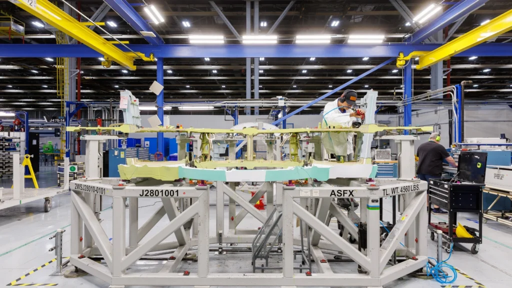 A Lockheed Martin employee works on one of the CWA bulkheads for Switzerland’s first F-35